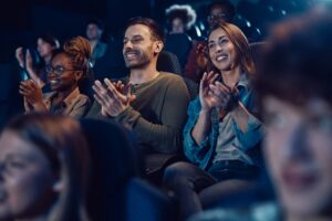 people applauding in a theatre